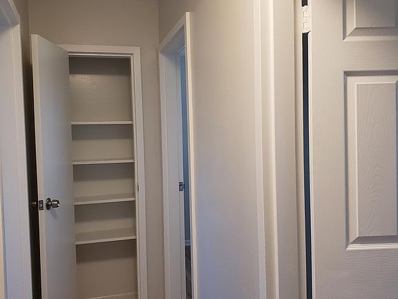 Freshly painted walls, hall closet and newly finished hard wood floors