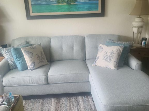 Living room with large sectional separate seating area and media center