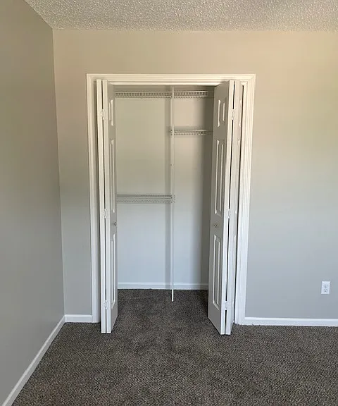 Custom wire closet shelving in front bedroom