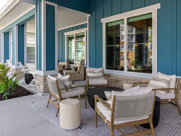 Settle into the shaded front porch lounge with a gas fire pit, a welcoming spot to enjoy the Southwest Florida breeze right outside the clubhouse.
