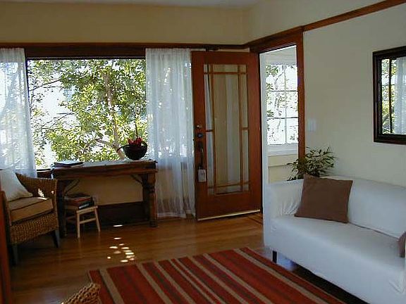 Living Room w/coved ceiling and ribbon paneling on original hardwood floors