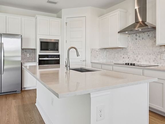 Kitchen in the Cardinal floorplan at 16435 Marsh Lane.