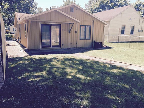 Private back porch and fenced in yard