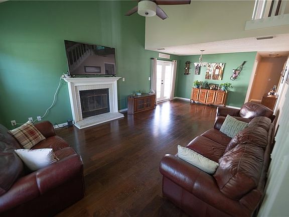 Open floor plan living & dining area with gas fireplace