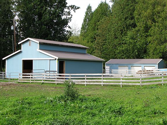 4 stall barn w/tack room & hay storage & 3 bay shop w/office