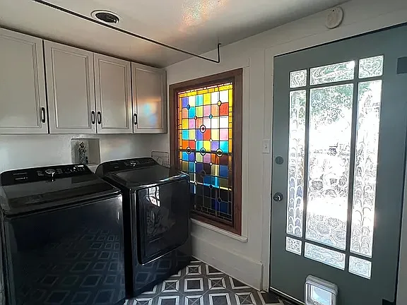 Main house laundry room with large-capacity washer and dryer