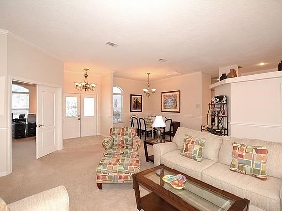 Welcome your guests through the double glass door entry into this lovely bright, open and spacious living area.