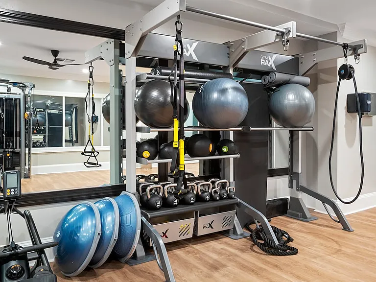 Suites Building fitness center with strength equipment