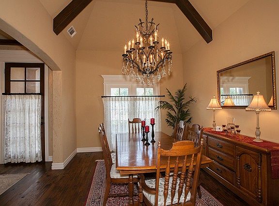 Dining has vaulted ceilings and beams