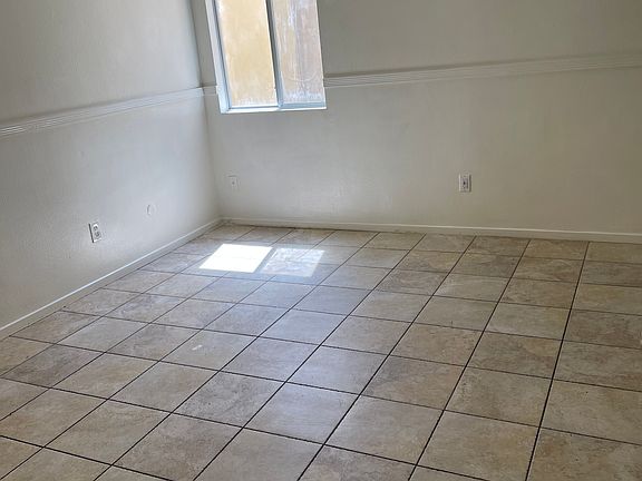 Bedroom 2 with adjoining 3/4 bath, tile floors, customized bath and closet and ceiling fan