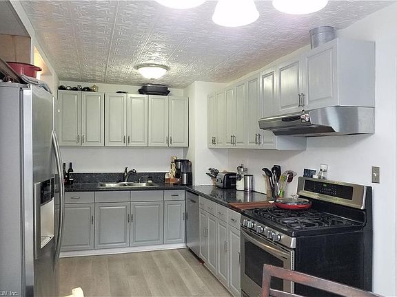 Updated Kitchen features Granite & SS Appliances w/ gas Stove and Lots of Cabinet Space!
