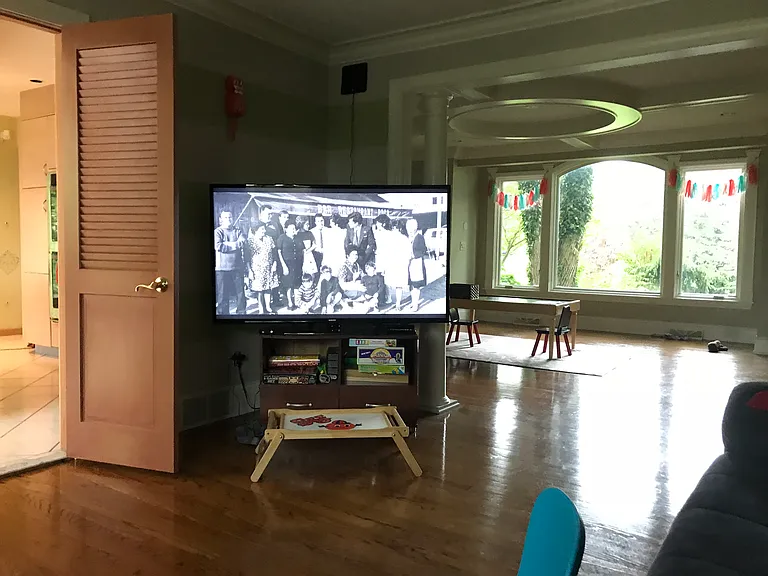 View from side room into dining room/large front room.