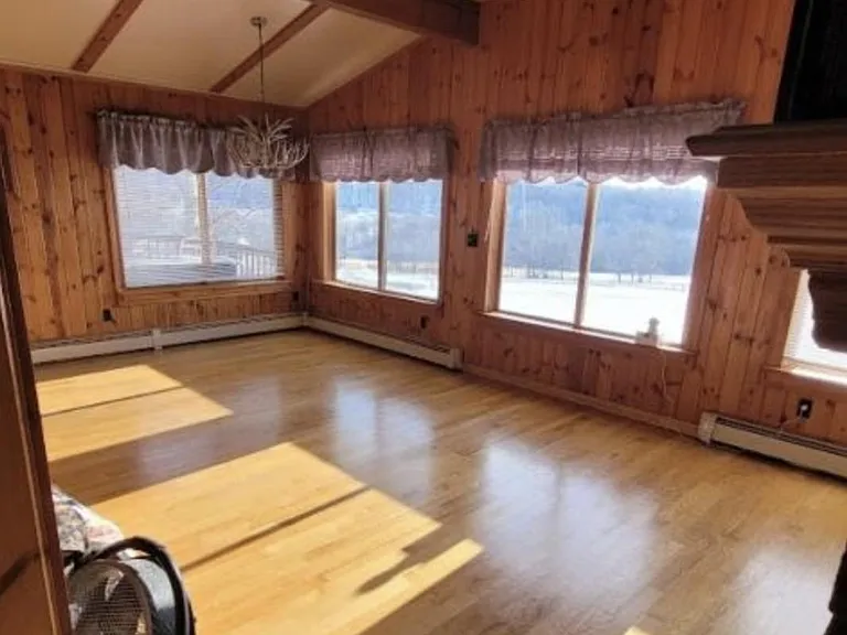 Great room consists of large windows beautiful views dining living room combination