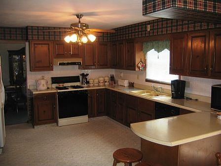 Enjoy this large eat-in kitchen with lots of cabinet and counter space!