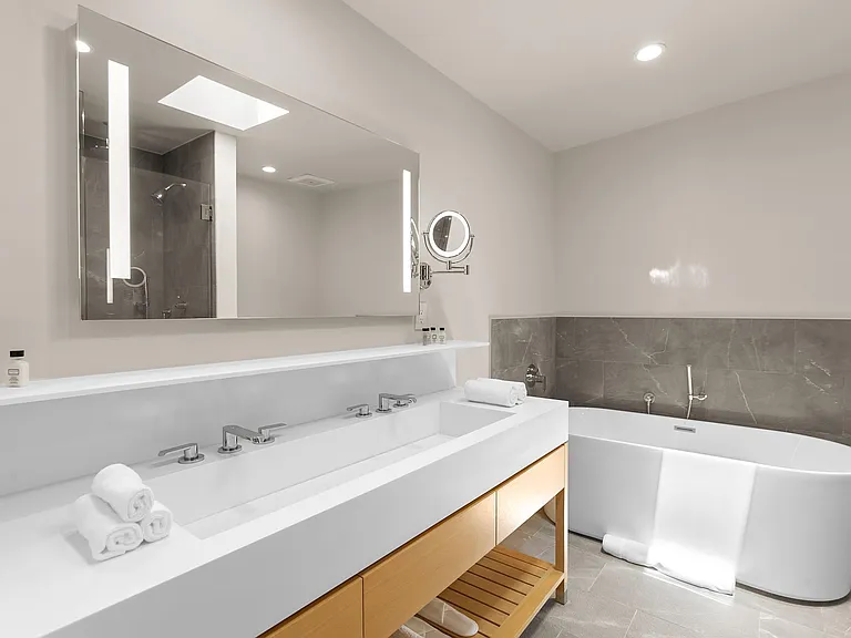 Deep soaking bathtub for pure relaxation with a glass of wine.