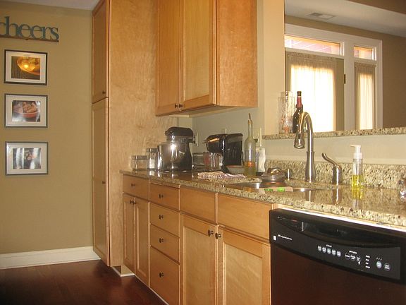 Kitchen has granite and stainless steel.