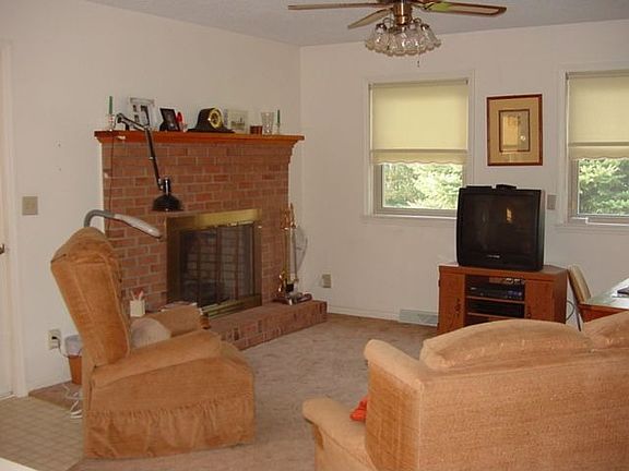 The living room has a propane fireplace for added warmth.
