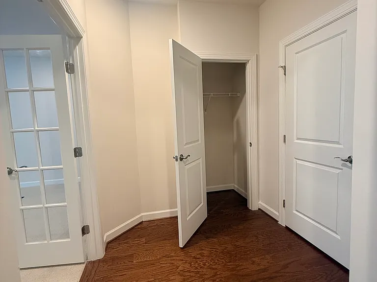 French doors and private closet in foyer leading into studio
