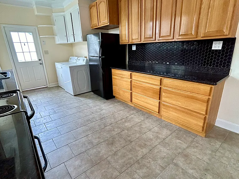 washer and dryer included. storage above
