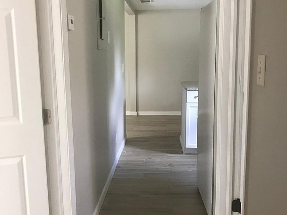 Hallway leading out to the living room and kitchen.