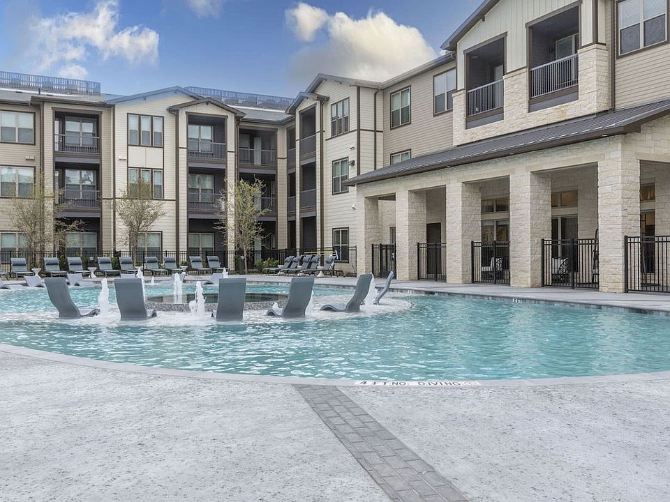 Resort-Style Pool with Grilling Area, Tanning Ledges, Cabanas & Hot Tub at The Bridge at McKinney