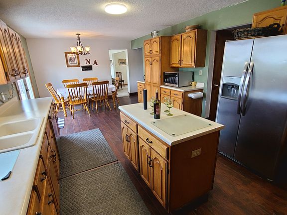 Large eat in kitchen with 2 microwaves and deck access.
