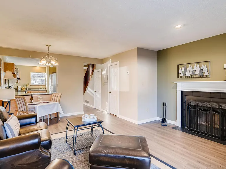This is an older photo of the living room, the mantle has been removed and the wall is different.