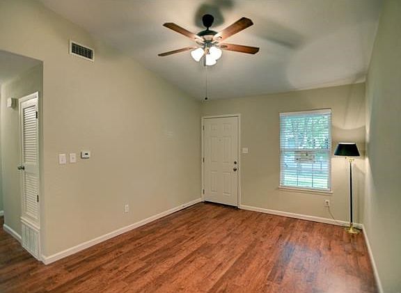 Living room looking in at the bedroom hallway. Nice, clean flooring throughout.