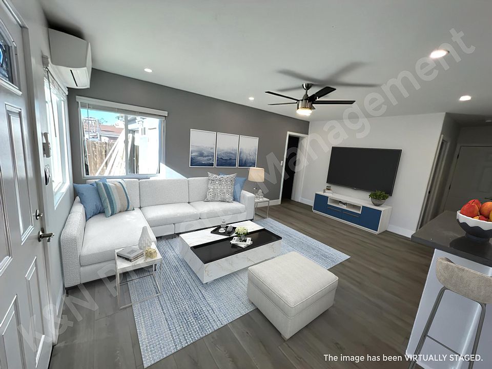 Large open living room with lots of natural light