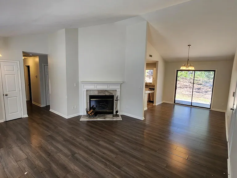 new paint and new carpet, smooth ceilings, vaulted in the living room.