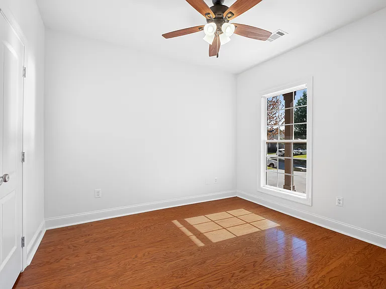 Wood floors continue into bedroom 2.