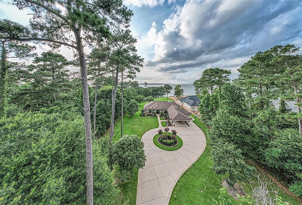 Image 1: WOW!!! Feel like you are on vacation every day! FOUR acres, WATERFRONT, and PRISTINE!!!