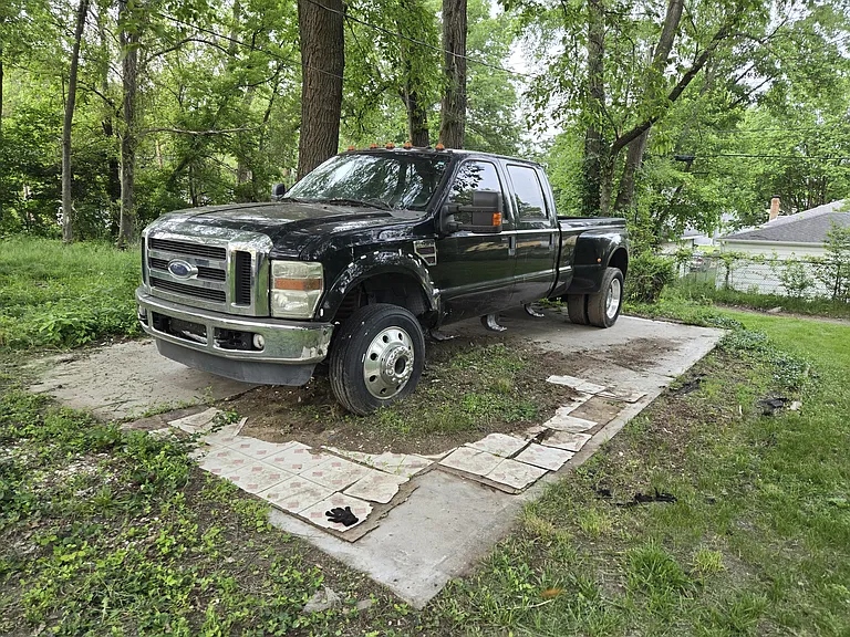 Detached garage demolished, concrete floor removal scheduled for summer 2026