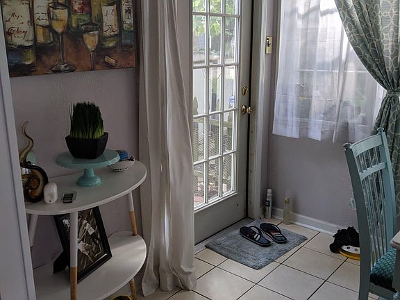 Sun Room and side door adjacent to driveway