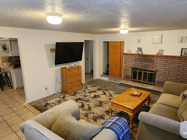 Upstairs Livingroom with newer large, high definition 65 inch TV.