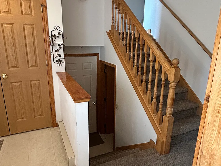 Stairway to upstairs or down to the garage and laundry/utility room
