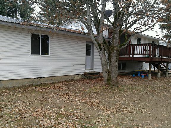 Back of house with big deck