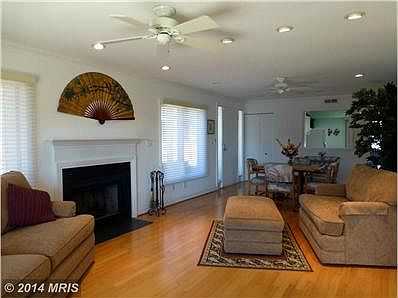 LIVING ROOM WITH WOOD BURNING FIREPLACE