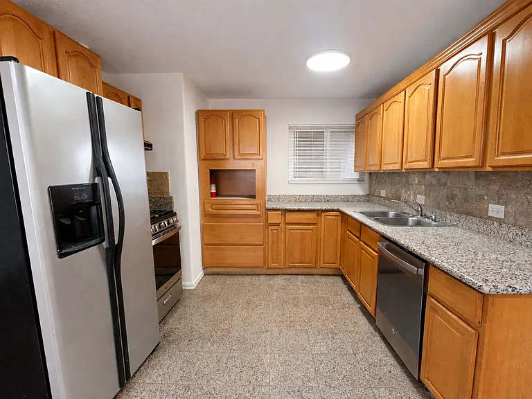 Large kitchen with plenty of cabinets and storage.