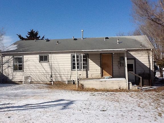 Back of house with covered porch.