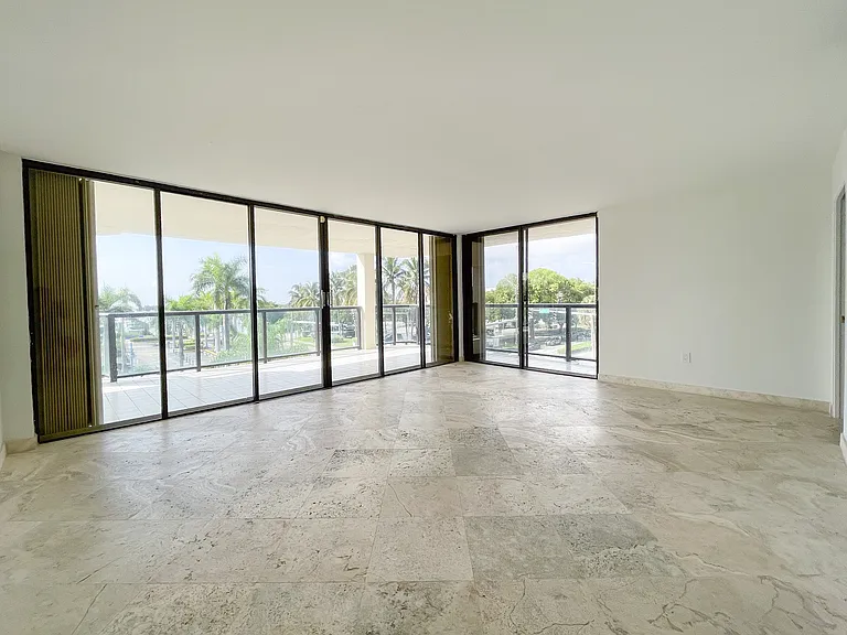 Comfortable enough for an office, lounging and sleeping spaces, the primary bedroom offers an oasis with bay views.