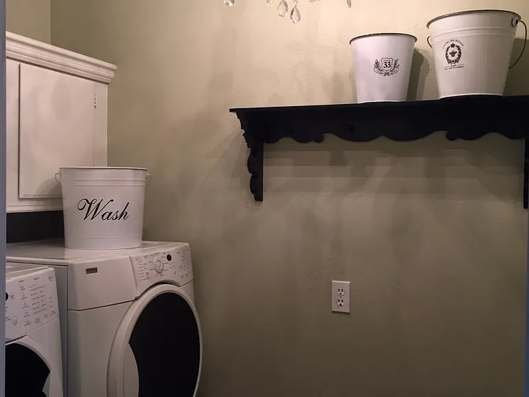 Laundry room with front loading washer and dryer.