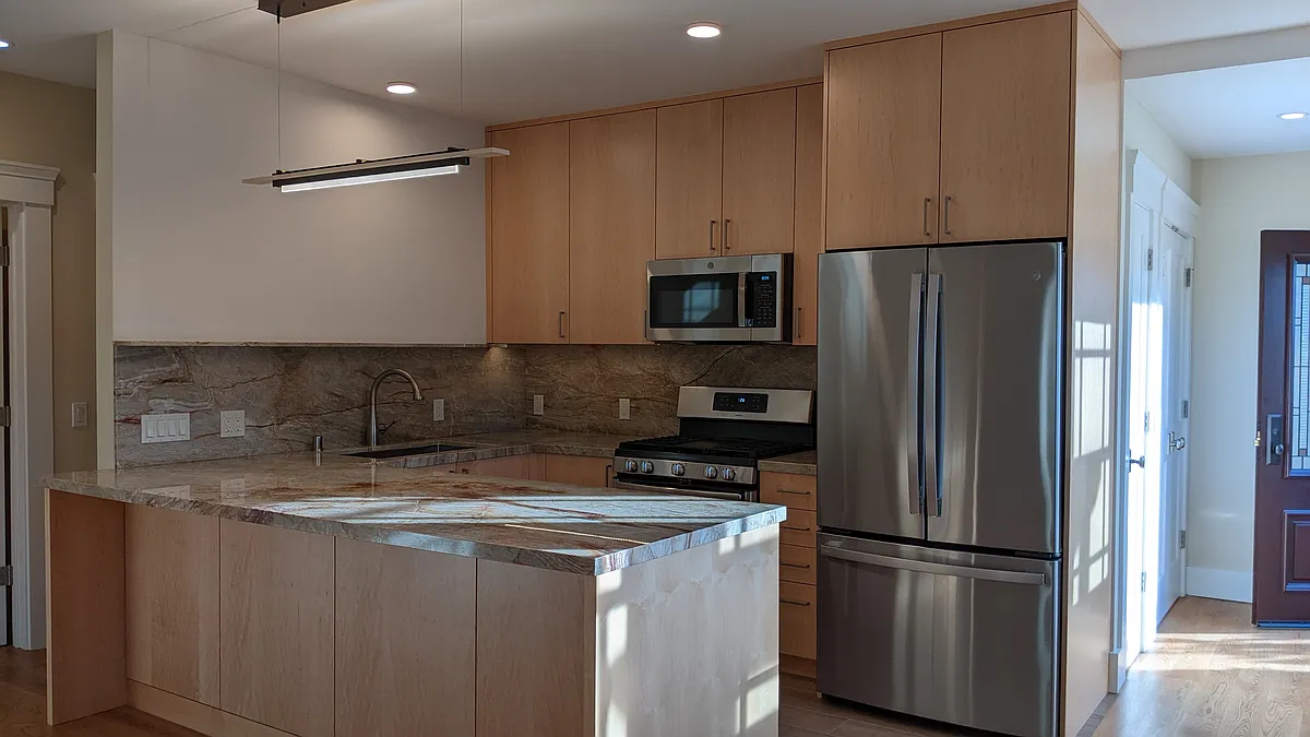 2. Kitchen detail, peninsula, quartzite, appliances. - 1201 Carlotta Ave