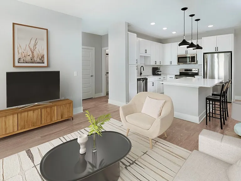 Kitchen, living, and dining areas with hard surface flooring