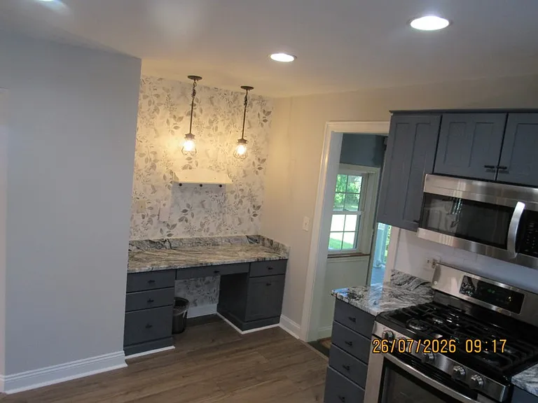 another view of the kitchen showing a message center area