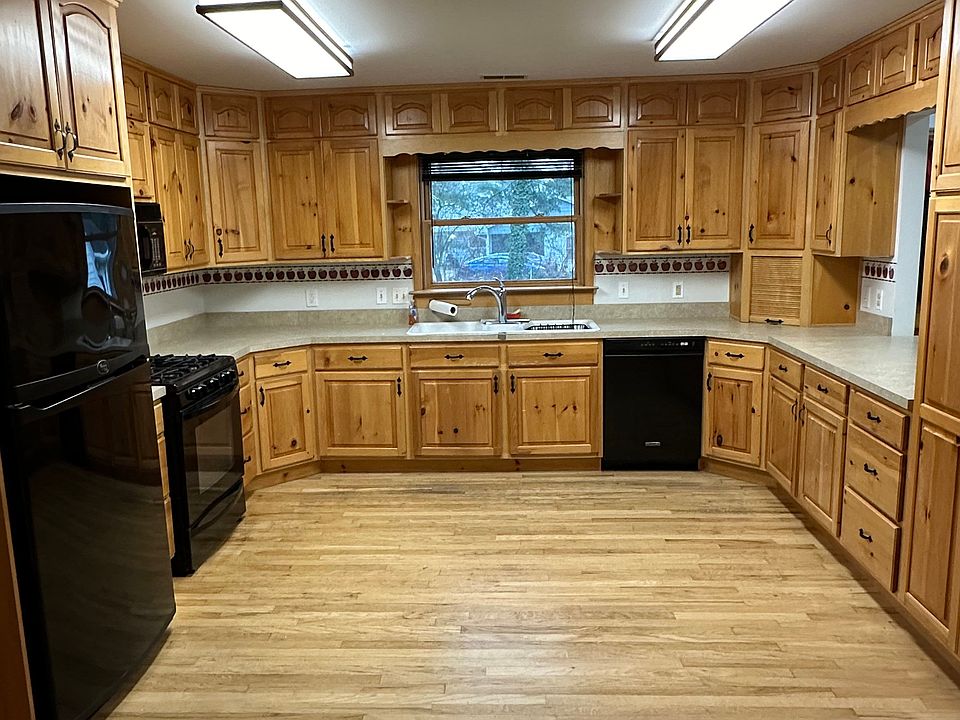 Very spacious kitchen with plenty of storage and counter space. Opening with island into living room.