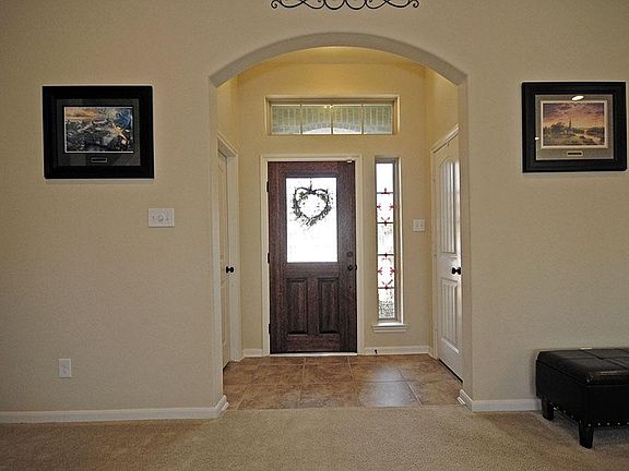 The entry way is bright with natural light and opens to the family room.