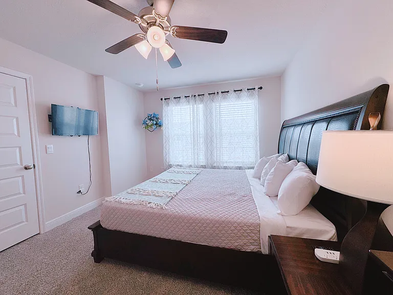 Master bedroom with comfortable king size bed, smart TV connected Wi-Fi Internet walking closet , dresser with the mirror plenty space for the drawers,