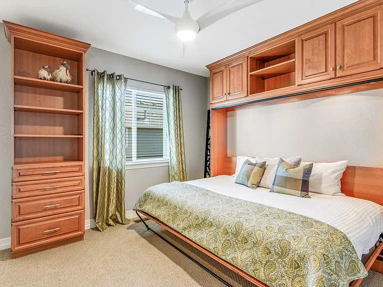 Guest Bedroom could double as an exercise room as this is a fold into the wall Queen murphy bed