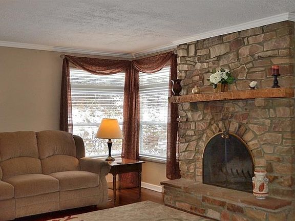 LIVING ROOM:  Corner windows flood the living room with an abundance of natural light!